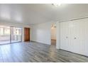 An open concept living room with sliding glass door and closet at 1351 N Pleasant Dr # 1031, Chandler, AZ 85225