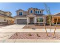 Attractive two-story house displaying well-kept landscaping, a driveway, and modern design at 20941 E Via Del Sol St, Queen Creek, AZ 85142