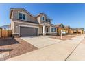 Attractive two-story home with an attached two car garage, driveway, and neutral stucco at 20941 E Via Del Sol St, Queen Creek, AZ 85142