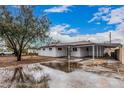 Charming exterior of this newly renovated home featuring a covered parking area and spacious front yard at 2904 W Coolidge St, Phoenix, AZ 85017