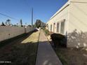 Well-maintained community featuring sidewalks, desert landscaping, and mature trees at 3107 W Loma Ln, Phoenix, AZ 85051