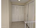 Bright and airy hallway features tile flooring, a closet, and access to other parts of the home at 3107 W Loma Ln, Phoenix, AZ 85051