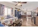 Large bonus room has laminate flooring, day bed, and desk perfect for a home office at 317 W Settlers Trl, Casa Grande, AZ 85122