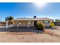 Charming single-story home with a covered porch and xeriscape landscaping at 545 N 98Th St, Mesa, AZ 85207
