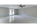 An open living room with tile floors and a ceiling fan at 7530 E Mariposa Dr, Scottsdale, AZ 85251
