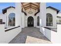 Grand entryway with a striking dark door, high ceilings, and elegant architectural details at 7816 S Lakeshore Dr, Tempe, AZ 85284