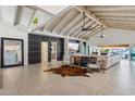 Bright, expansive living room with high ceilings, modern decor, and seamless indoor-outdoor flow at 7816 S Lakeshore Dr, Tempe, AZ 85284
