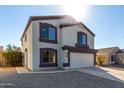 Charming two-story home with a two-car garage and low maintenance gravel landscaping at 11457 W Madisen Ellise Dr, Surprise, AZ 85378