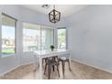 Bright dining area with natural light and a modern light fixture at 14547 W Evans Dr, Surprise, AZ 85379