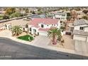 Beautiful two-story home showcasing a red tile roof, desert landscaping, and an attached three-car garage at 14674 W Windsor Ave, Goodyear, AZ 85395