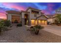 Charming home with a three-car garage and tasteful desert landscaping at 15652 N 175Th Ct, Surprise, AZ 85388