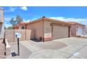 Inviting home with a private entrance, featuring a spacious two-car garage and gated access at 1762 N Terrace Cir, Casa Grande, AZ 85122