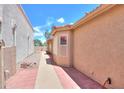 Tiled walkway and low-maintenance landscape provide great side yard appeal at 1762 N Terrace Cir, Casa Grande, AZ 85122