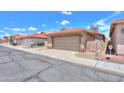 Charming neighborhood street featuring homes with red tile roofs and well-maintained exteriors at 1762 N Terrace Cir, Casa Grande, AZ 85122