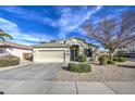 Charming single-Gathering home with a two-car garage, desert landscaping, and a well-maintained front yard at 20477 N 91St Dr, Peoria, AZ 85382