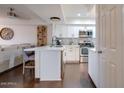 Modern kitchen featuring white cabinetry, stainless appliances, and stylish backsplash at 2142 E Turney Ave # 4, Phoenix, AZ 85016