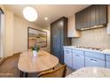 Eat-in kitchen with modern appliances, unique tiled backsplash, and stylish finishes at 2201 N Central Ave # 2A, Phoenix, AZ 85004