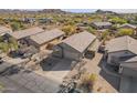 Aerial view showcases this property in a desert community with mountain views at 6589 E Casa De Leon Ln, Gold Canyon, AZ 85118