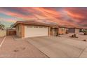 A beautiful single-story home with a spacious two-car garage and well-kept desert landscaping at 8012 E Monte Ave, Mesa, AZ 85209