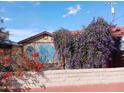 A charming backyard view of a pergola next to a painted storage shed at 94 W 12Th St, Florence, AZ 85132