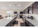 Well-equipped kitchen with granite counters, stainless appliances, and a functional layout for cooking at 1021 W Descanso Canyon Dr, Casa Grande, AZ 85122