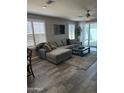 Inviting living room with modern ceiling fan, lots of natural light, and sliding door to patio at 1030 E Susan Ln, Tempe, AZ 85288