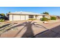 Beautiful home with desert landscaping and an attached two-car garage at 13234 W Desert Glen Dr, Sun City West, AZ 85375