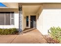 Charming front porch with decorative ironwork and ample shade at 13234 W Desert Glen Dr, Sun City West, AZ 85375