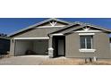 Charming single-story home with a two-car garage and neutral-toned stucco exterior at 15752 W Beryl Ave, Waddell, AZ 85355