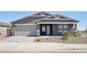 Attractive single-story house with a two-car garage and manicured landscaping in a desirable community at 15762 W Cheryl Dr, Waddell, AZ 85355
