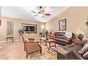 Comfortable living room featuring stylish furnishings, a ceiling fan, and a large television at 16412 N 168Th Ln, Surprise, AZ 85388