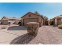 Single-story home with a two-car garage and low-maintenance desert landscaping at 1903 E San Tan St, Chandler, AZ 85225