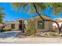 Stunning single-story home featuring desert landscaping, a charming facade, and a welcoming entrance at 19460 N 84Th St, Scottsdale, AZ 85255