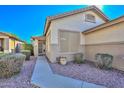 Charming front entrance with security door, manicured shrubbery, and gravel landscaping at 21511 N 79Th Dr, Peoria, AZ 85382