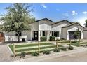 Charming single-Gathering home featuring a white exterior, modern design, and well-manicured front yard at 3007 N 47Th St, Phoenix, AZ 85018