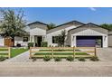 Charming single-Gathering home featuring a white exterior, modern design, and well-manicured front yard at 3007 N 47Th St, Phoenix, AZ 85018