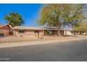 Cozy single story brick home with desert landscaping and solar panels at 4550 W Bloomfield Rd, Glendale, AZ 85304