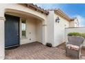 Inviting front porch area with a cozy chair and a glimpse of the front door at 5624 S Winchester --, Mesa, AZ 85212