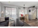 The dining area has a table and bay windows offering plenty of natural light at 111 S Greenfield Rd # 97, Mesa, AZ 85206