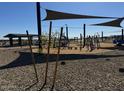 Community playground featuring slides, swings, and shaded areas for children to play at 15744 W Beryl Ave, Waddell, AZ 85355