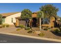 Attractive home with desert landscaping including mature trees and shrubs with pavers on the driveway at 18068 E Curva De Plata --, Rio Verde, AZ 85263