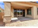 Outdoor patio area featuring a covered space and a sliding glass door at 20931 E Via Del Sol St, Queen Creek, AZ 85142