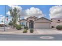 Charming single-story home featuring desert landscaping and a two-car garage at 2477 E Valencia Dr, Casa Grande, AZ 85194