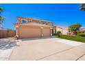 Attractive home showcasing a three-car garage, inviting landscaping, and a serene neighborhood ambiance at 2535 E Saratoga St, Gilbert, AZ 85296