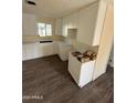 New kitchen featuring white cabinets and ample counter space at 2540 E Hartford Ave, Phoenix, AZ 85032