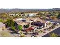 Beautifully landscaped single-story home with a brick-paved entrance and courtyard at 27701 N Lucero Dr, Rio Verde, AZ 85263