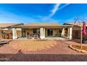 View of the covered patio in the backyard with a rock garden at 30124 N Sunray Dr, San Tan Valley, AZ 85143