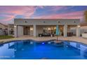 Stunning backyard pool with covered patio and ample seating, perfect for outdoor relaxation at 3459 E Mockingbird Dr, Gilbert, AZ 85234