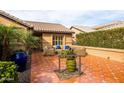 Cozy patio featuring tiled floors, comfortable seating, and decorative plants, ideal for enjoying the outdoors at 3648 N 162Nd Ave, Goodyear, AZ 85395