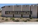 Hurley Ranch community sign with lush landscaping, providing a welcoming and grand entrance to the neighborhood at 3720 S 87Th Dr, Tolleson, AZ 85353